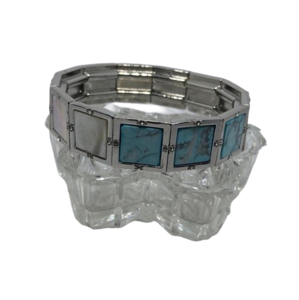 SILVER tone stretch stone and mop inlay bracelet with turquoise like stones.